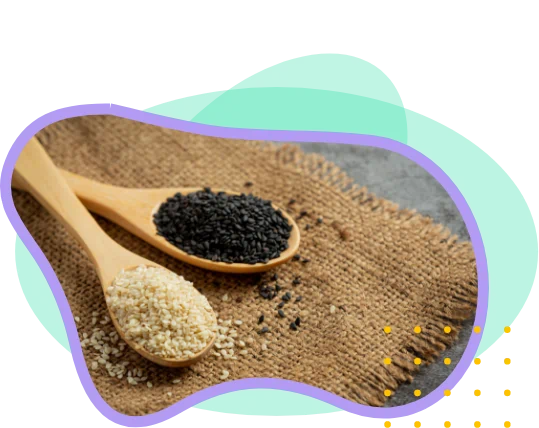 Spoonfuls of white and black sesame seeds